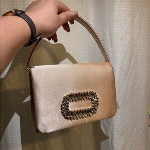 Elegant Beige Handbag with Embellished Buckle